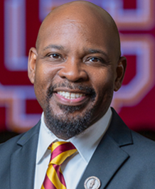 Dr. Julius John